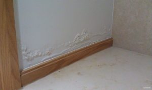 What are the causes of water leaks in indoor walls?